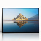 Large abstract wall art depicting a European scenery in muted colors, framed in black acrylic.