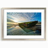 Extra large abstract art print depicting a textured scenery of Normandy in muted earth tones, framed in silver.