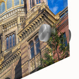 Large abstract wall art depicting the Berlin skyline in muted gray and blue tones on acrylic glass.