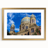 Abstract art print of Berlin cityscape in muted gray and blue tones, framed in gold, suitable for dining room decor.