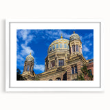 Textured abstract art print of Berlin skyline in muted gray and blue tones on a framed white mat.