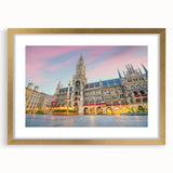 Abstract art print of Munich skyline in muted gold and blue tones on a framed canvas, suitable for dining room decor.