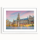 Textured art print of an abstract Munich cityscape in muted blue and gray tones on a framed white canvas.