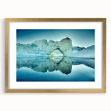 Abstract art print featuring a Greenland landscape in muted green and blue tones, framed in gold.