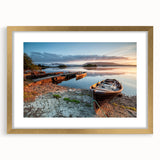 Abstract art print of a European Irish landscape in muted green and blue tones, framed in gold.