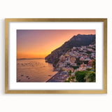 Abstract art print of the Amalfi Coast in muted blue and green tones on a framed canvas, suitable for dining room decor.