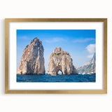 Abstract art print of Capri, Italy in muted earth tones on a framed canvas, suitable for bedroom or dining room decor.