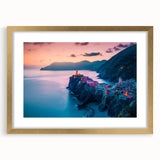Abstract art print of Cinque Terre in muted colors, framed in gold, ideal for dining room decor.