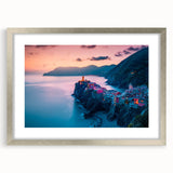 Extra large wall art depicting the Cinque Terre coastline in pastel shades on a framed canvas, ideal for living room decor.