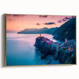 Framed canvas featuring a vintage-style landscape painting of Cinque Terre, Italy, with vivid blue and green tones.