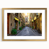 Abstract art print of Florence skyline in muted gold and earth tones on a framed canvas, ideal for dining room decor.