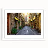 Textured abstract print of Florence scenery in muted earth tones on a framed white mat, suitable for bedroom art.