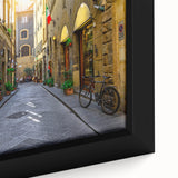 Close-up of extra large framed canvas featuring a textured, colorful depiction of Florence scenery in black tones.