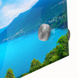 Large abstract wall art of Lake Como with muted blues and greens on acrylic glass, suitable for dining room ambiance.
