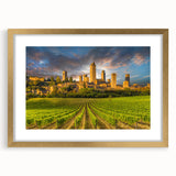 Abstract art print of Tuscany landscape in muted earth tones on a framed gold mat, suitable for dining room decor.