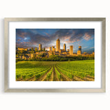 Extra large abstract art print of a Tuscan landscape in muted earth tones on a textured canvas, framed in silver.