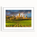 Textured art print of a Tuscan landscape in muted earth tones on a framed white mat, ideal for bedroom wall decor.