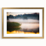 Abstract art print of a European landscape in muted gold and green tones, framed with a gold mat.