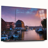 Large abstract wall art depicting a European scenery in muted earth tones on acrylic glass.