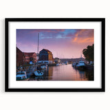 Extra large abstract art print featuring a colorful, textured depiction of a European scenery on a framed black mat canvas.