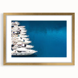 Abstract art print of Monaco scenery in muted gold and blue tones on a framed canvas, suitable for dining room decor.