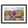 Extra large abstract art print of a colorful European scenery on textured canvas, framed in black.