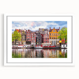 Textured abstract art print of a European scenery in muted earth tones, framed with a white mat, suitable for bedroom decor.