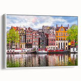 Vintage poster art of a colorful European scenery on a large framed canvas, ideal for living room decor.