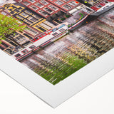 Art deco poster of a European landscape with vibrant green and blue tones on rolled canvas.