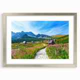 Extra large abstract art print of a textured European scenery in muted earth tones, framed in silver.