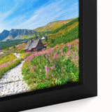 Extra large framed canvas featuring a textured depiction of a European scenery in black with colorful art accents.