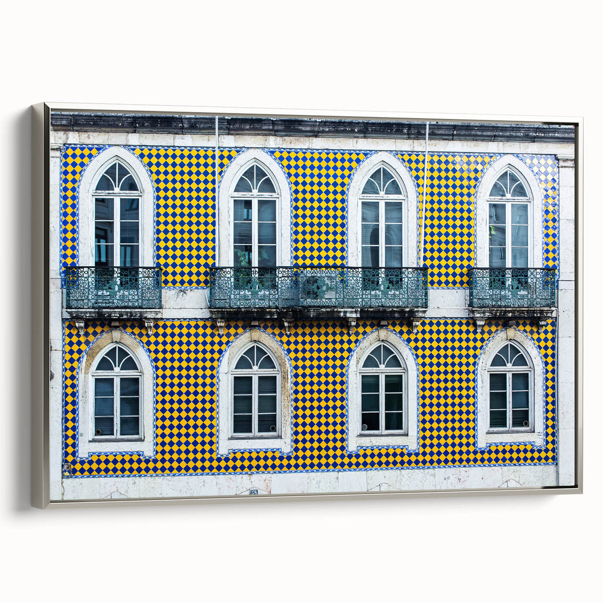 Framed canvas of Lisbon landscape featuring colorful vintage poster art on a black background, ideal for living room decor.