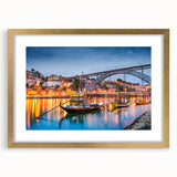 Abstract art print of Porto scenery in muted blue and orange tones, framed in gold.