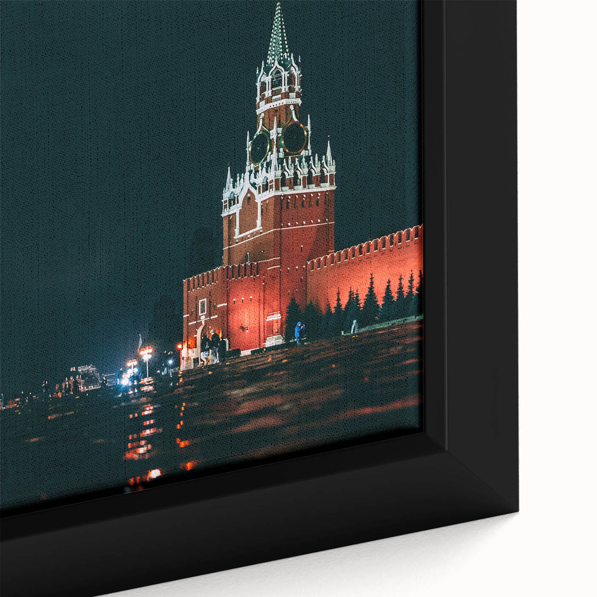 Close-up of black wall art featuring a textured Moscow cityscape on framed canvas, with colorful accents.
