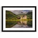 Abstract art print of a colorful, textured Scottish landscape, framed in black, ideal for living room decor.