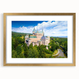 Abstract art print of a European scenery in muted earth tones, framed in gold, suitable for bedroom or dining room decor.