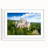 Textured abstract art print depicting a European scenery in muted earth tones, framed with a white mat.