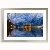 Abstract art print of a Slovenian landscape in muted green and blue tones, framed in silver.
