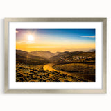 Abstract art print of Andalucian landscape in muted earth tones, framed in silver, ideal for dining room decor.