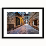 Abstract art print of Barcelona with vibrant, colorful textures on a large black-framed canvas, ideal for living room decor.