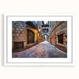 Abstract art print of Barcelona skyline in muted gray and blue tones on a framed white mat, ideal for dining room decor.