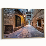 Framed canvas featuring a vintage-style landscape painting of Barcelona in muted gold and black tones.