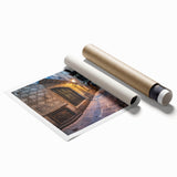 Extra large rolled print of a Barcelona cityscape with muted green and brown floral elements.