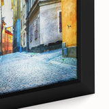 Extra large framed canvas of a textured Stockholm cityscape in black with vibrant colorful accents.