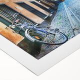 Art deco poster of Stockholm skyline in muted blue and gold tones on rolled canvas, suitable for dining room decor.