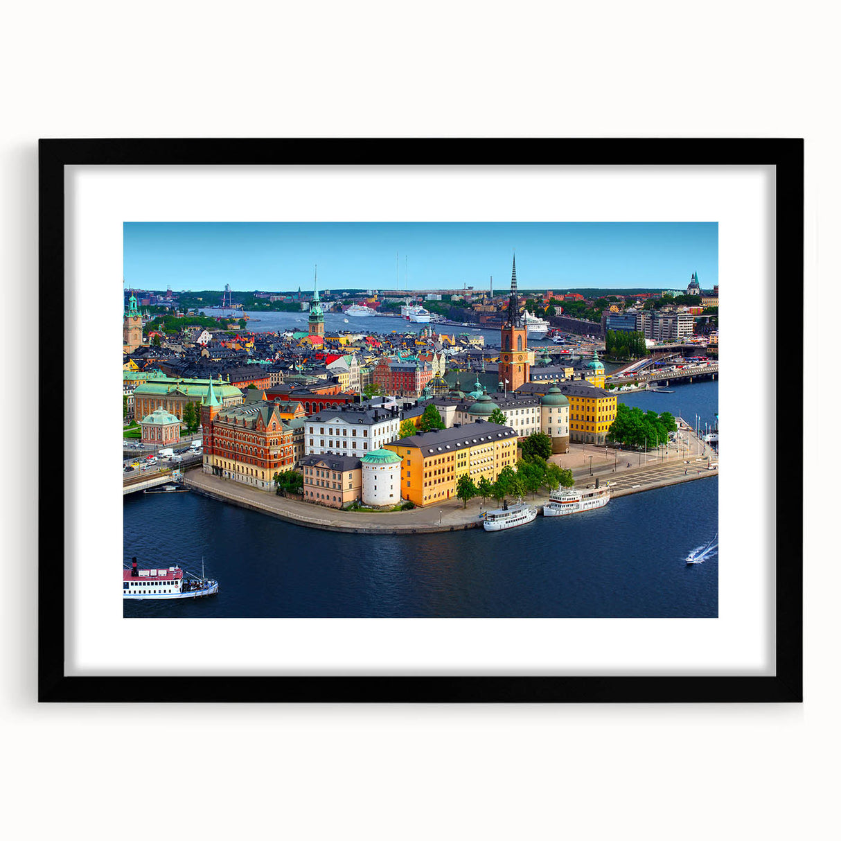 Extra large abstract art print depicting a colorful, textured European scenery on a black framed canvas.