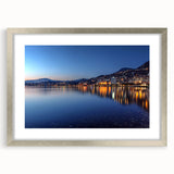 Textured art print of an abstract Geneva scenery in muted blue and gray tones on a silver-framed poster.