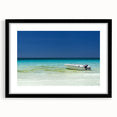 Abstract art print depicting vibrant, colorful Cancun scenery in a large black frame, ideal for living room wall decor.
