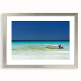 Textured abstract art print depicting Cancun scenery in soft pastel shades, framed in silver, ideal for bedroom wall decor.