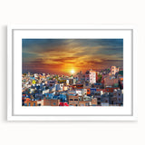 Abstract art print of Guanajuato scenery in vibrant hues on a framed white mat, ideal for dining room decor.